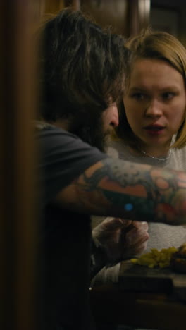 Two People Dining Indoors: A Candid Moment
