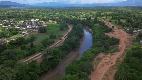 aerial view showing new build fence at river in dajabon province between haiti and dominican republic