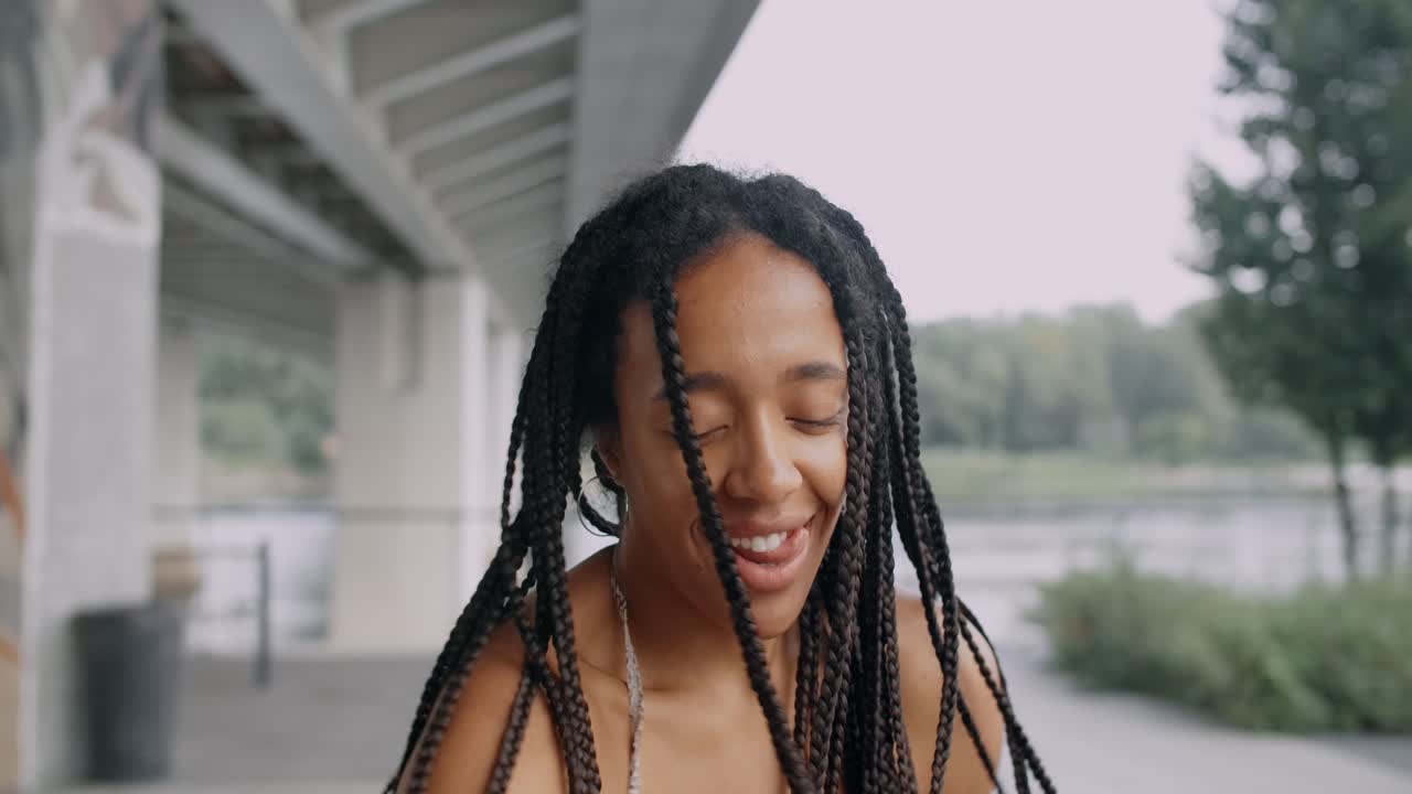 Happy Woman with Braids Outdoors