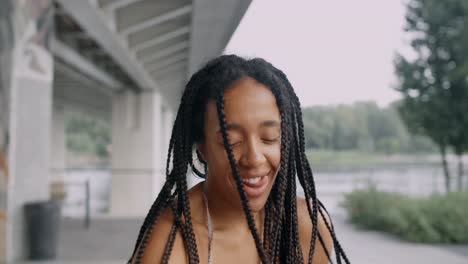 happy woman with braids outdoors