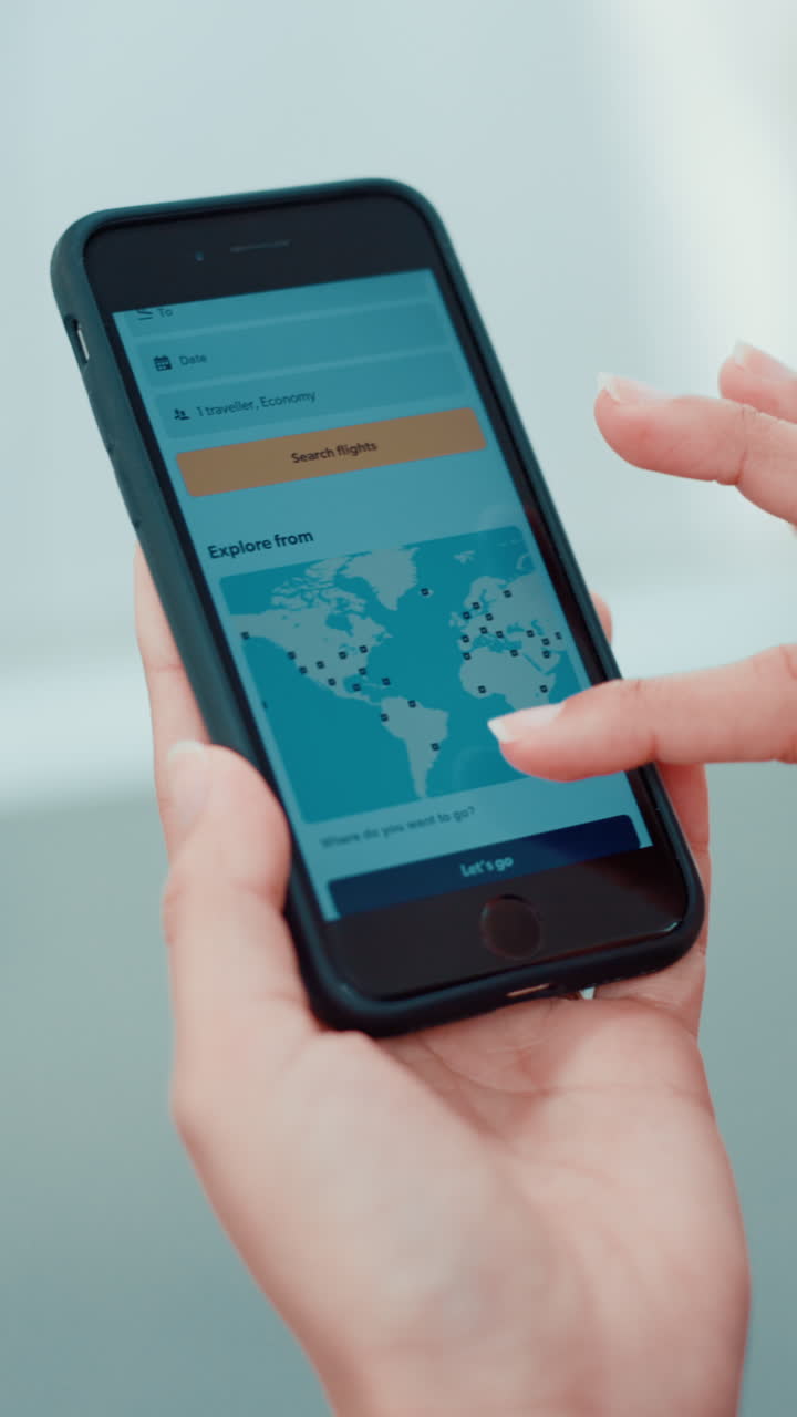 Close-Up of Hands Scrolling Through Flight Booking App on Smartphone