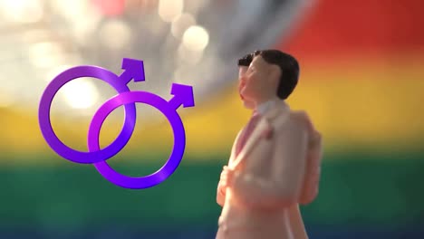 Two-joined-male-symbols-and-male-figurines-with-disco-ball