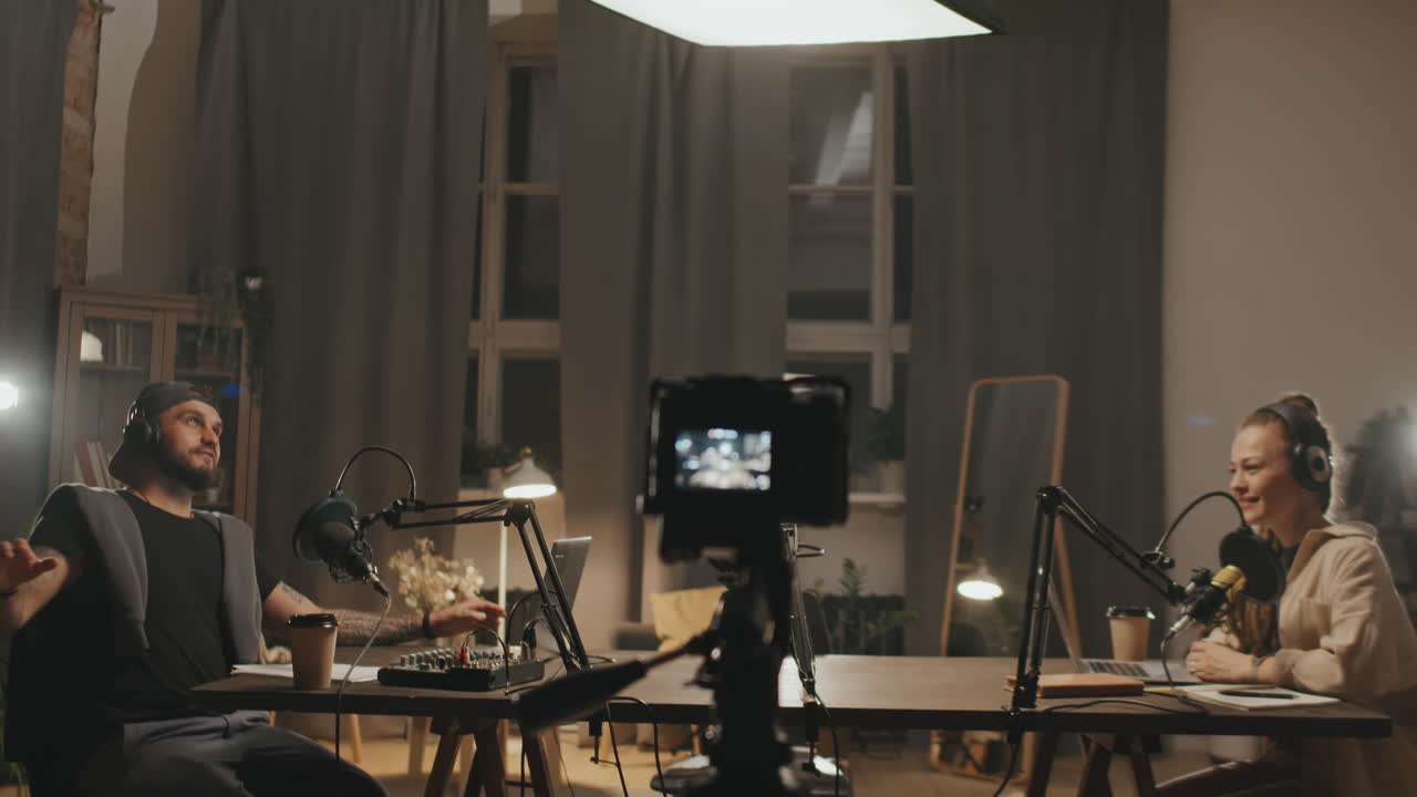 Man and Woman Recording Podcast at Home