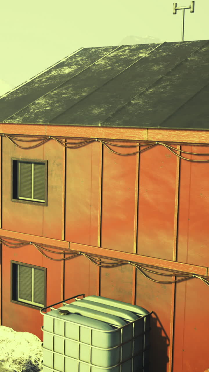Building with windows and exterior wires in a snowy location during daylight