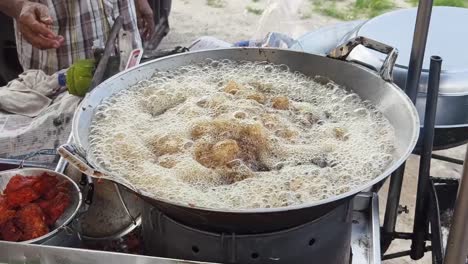 street food: fried chicken being cooked