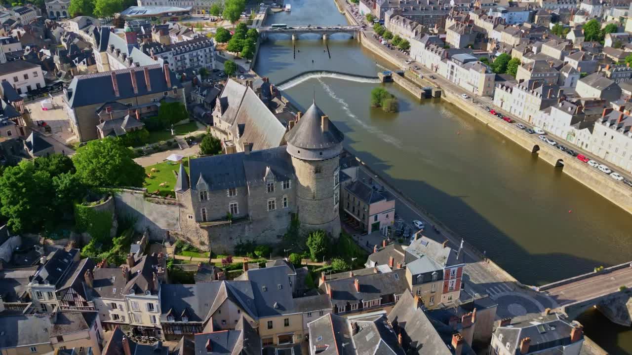 Hyperlapse panoramic drone movement around the Chateau-Neuf in Laval and Laval Castle with Place du 11-Novembre in background, Mayenne, France.