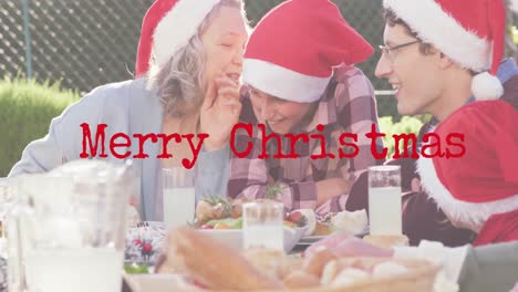 animation of christmas greetings text over caucasian family in santa hats at christmas table