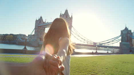 happy young woman walking holding her partners