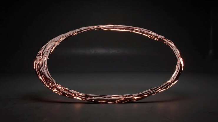 Rotating woven metal ring hovering above floor in studio on capture for glow with moving highlights