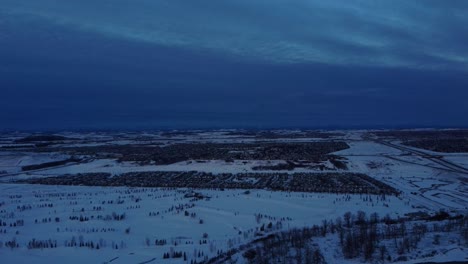 drone footage of calgary's community during a beautiful winter sunrise in a winter wonderland