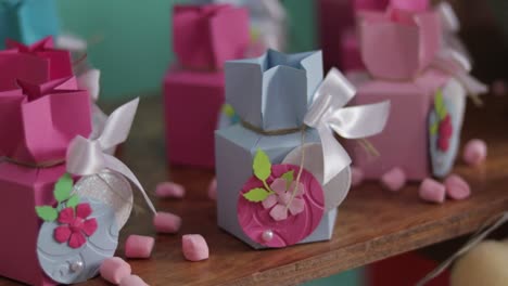 self-made paper boxes for candies in pink and blue colors