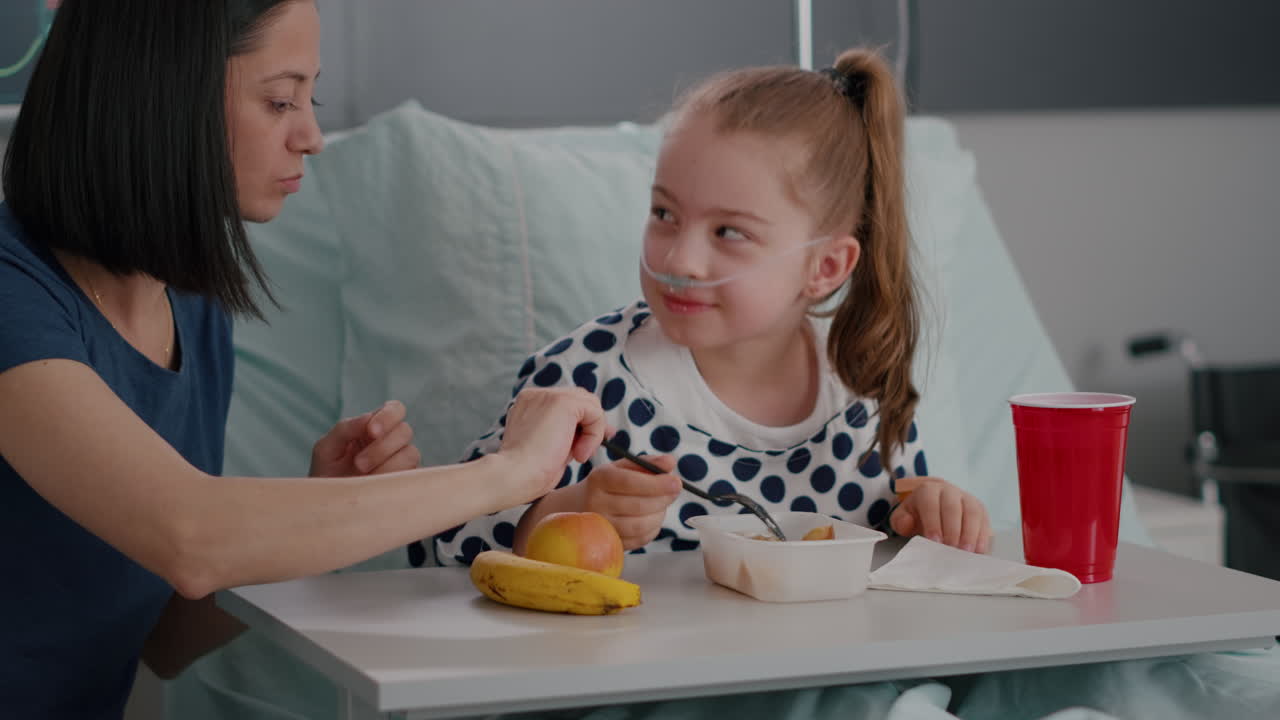 Portrait of hospitalized little chid lying in bed in recovery examination room