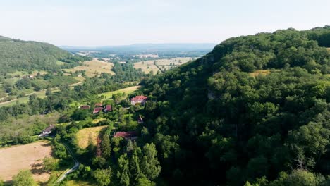 Drone-shot-over-a-forest-with-cliffs