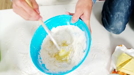 Father-and-son-preparing-cupcake