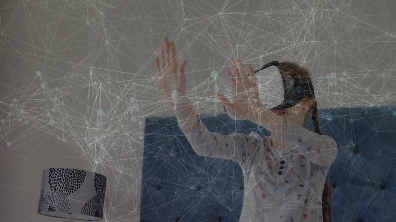 Girl wearing VR headset raising hands on bed interacting with network overlay in tech demo
