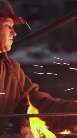 industrial worker observing molten metal