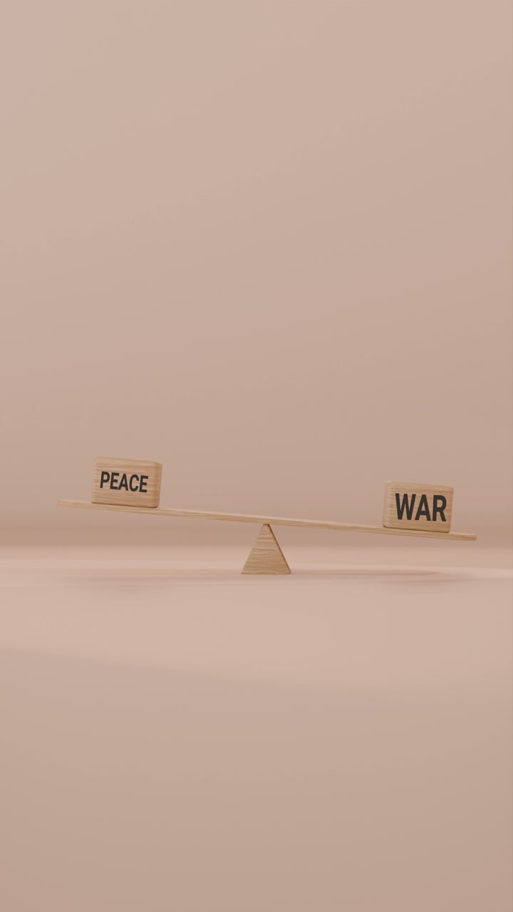 VERITCAL VIDEO OF PEACE AND WAR BALANCING ON SEESAW