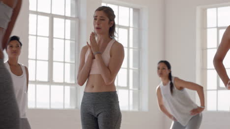 yoga class group of multiracial women chatting having conversation enjoying sharing lifestyle ready for workout in fitness studio at sunrise