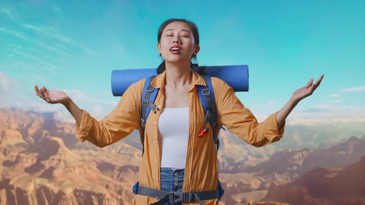 Asian Female Hiker With Mountaineering Backpack Smiling And Spreading Arms Enjoy Looking The View Around While Traveling At The Top Of Mountain