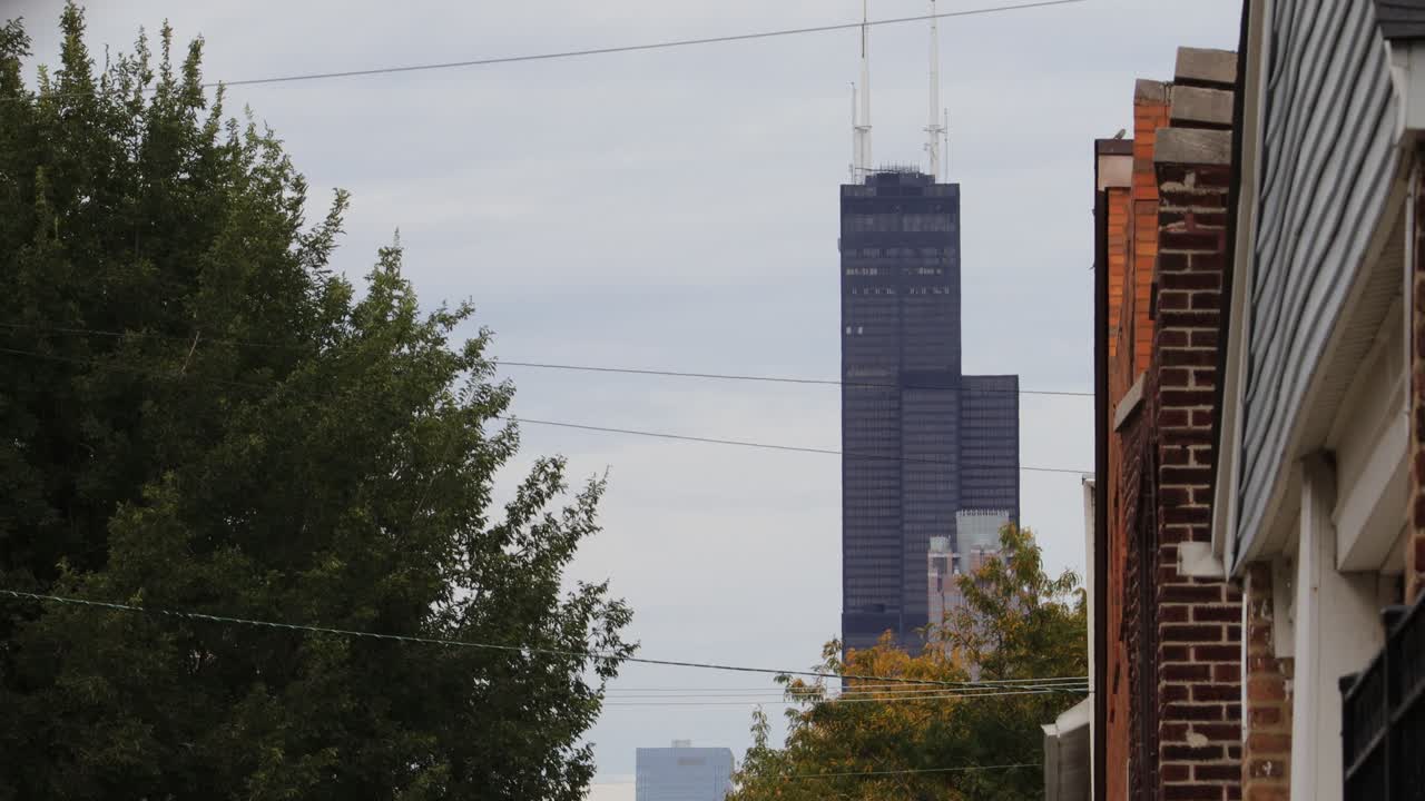 The view of Willis Tower from Chicago's Chinatown offers a striking contrast between the historic charm of the neighborhood and the modern skyline.