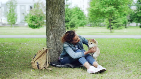 woman and her dog in a park
