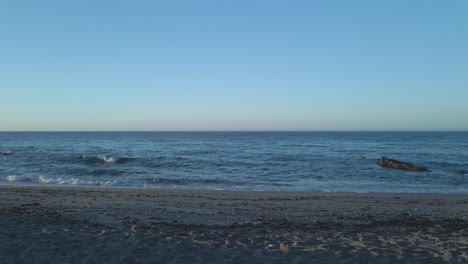 Static-shot-of-waves-and-sand-at-an-empty-beach