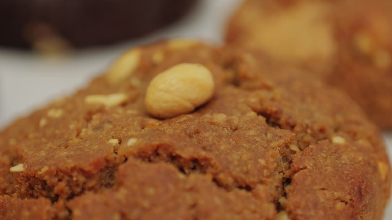 Fresh cookies with almonds in bakery shop close-up. Artisan sweets and bread is making by skill bakers using natural and high-quality ingredients. Food with health and flavour benefits. Sweet breads for dessert and breakfast. Bakery shop and market