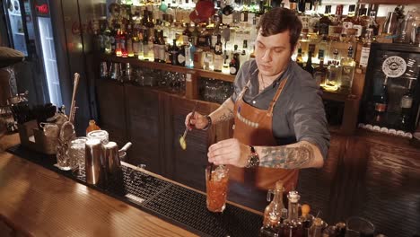 bartender making a bloody mary at a bar