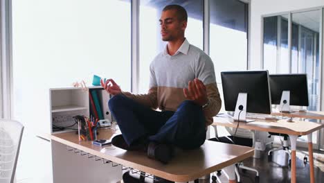 male executive doing yoga in office 4k