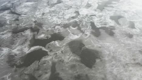 tilting to the surface of melting ice on a small lake