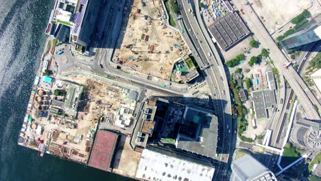 Hong-Kong-downtown-Kowloon-urban-area,-Top-down-aerial-view-with-traffic-and-city-skyscrapers