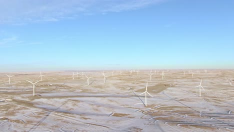 Aerial-shots-of-wind-turbines-on-a-cold-winter-afternoon-in-Calhan,-Colorado