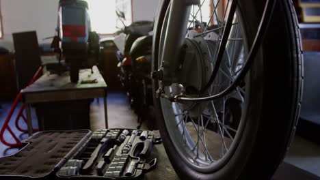 Close-up-of-motorbike-in-repair-garage-4k