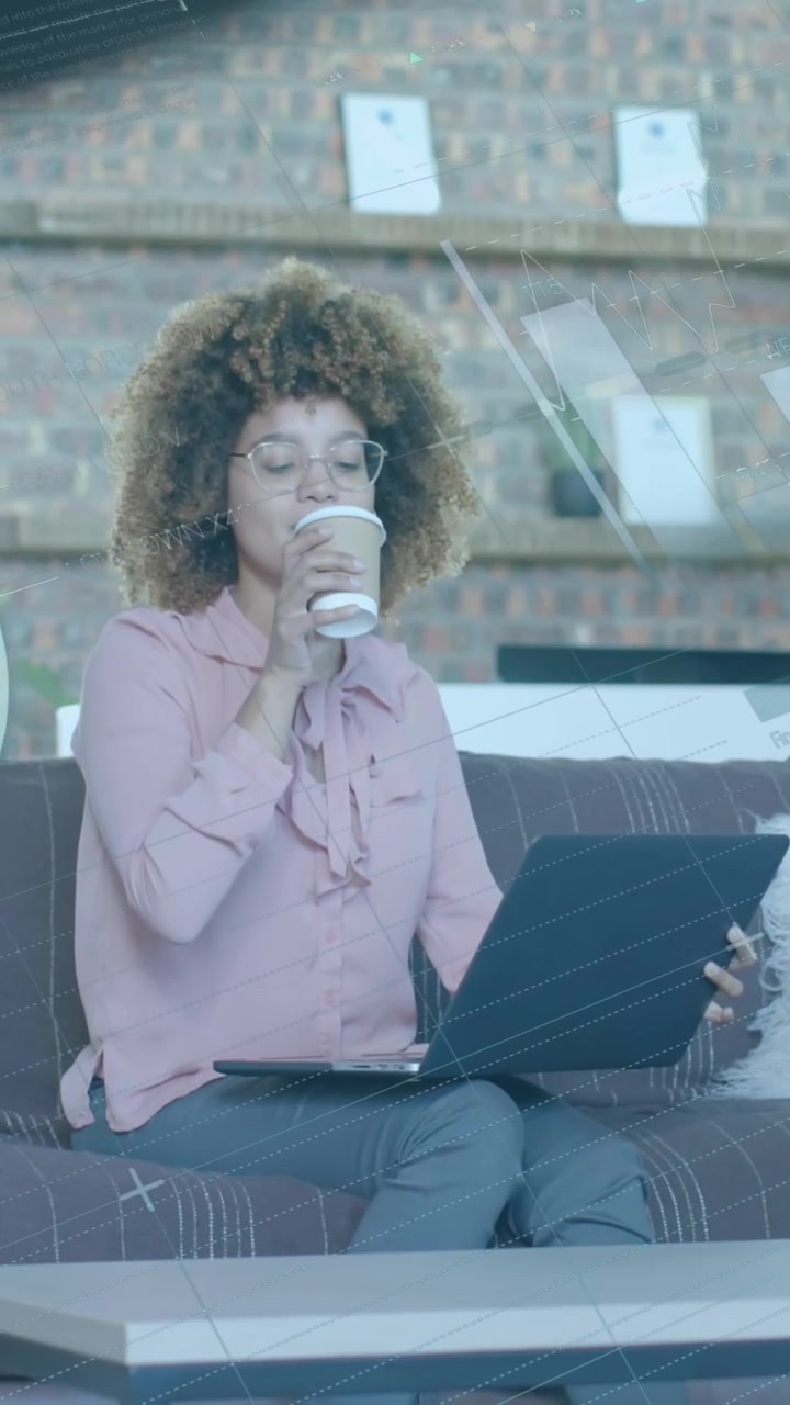 Data processing over casual businesswoman with laptop having coffee in office