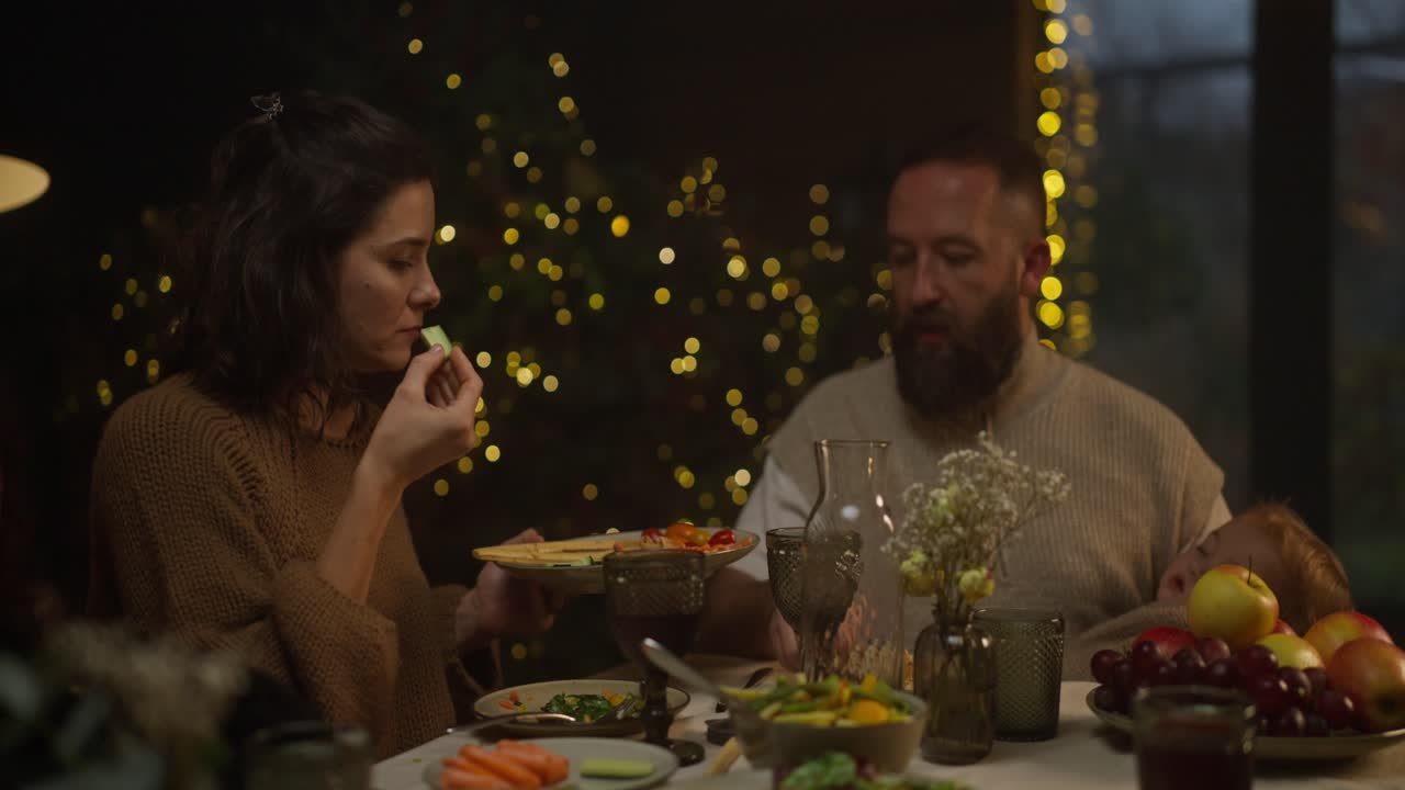 Family dinner with Christmas lights