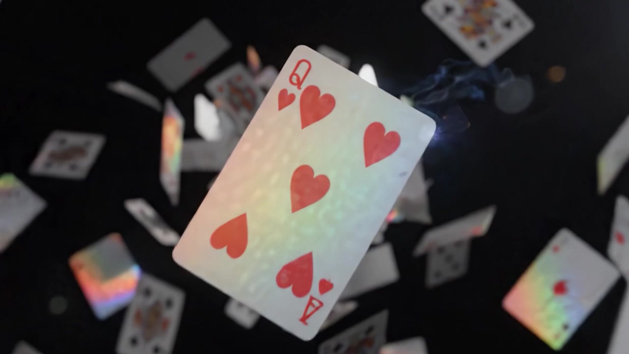 A Captivating Display of Cards in Motion: A Dynamic Showcase of Poker and Gaming Elements Captured in Stunning Visual Composition Against a Dark Background