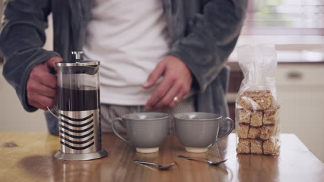 man making coffee and breakfast