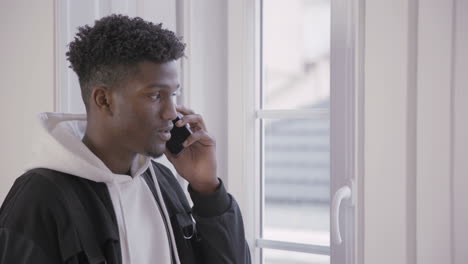 portrait of confident african american man talking on phone