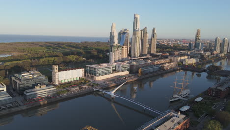 aerial view of puerto madero with modern corporate buildings and puente de la mujer. buenos aires, argentina.