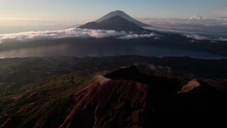 mount batur volcano overlooking the danau batur and mount abang at sunrise in bangli regency, bali, indonesia