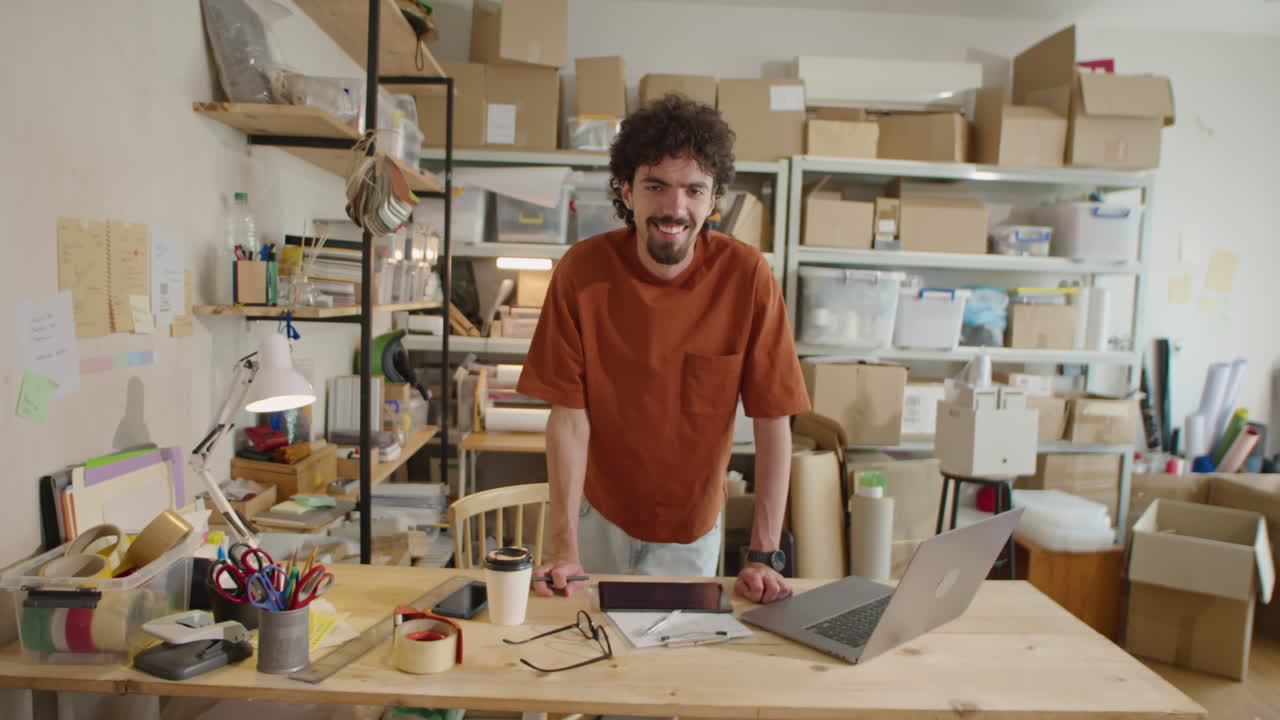 Portrait of Cheerful Man At Work in Delivery Service Warehouse