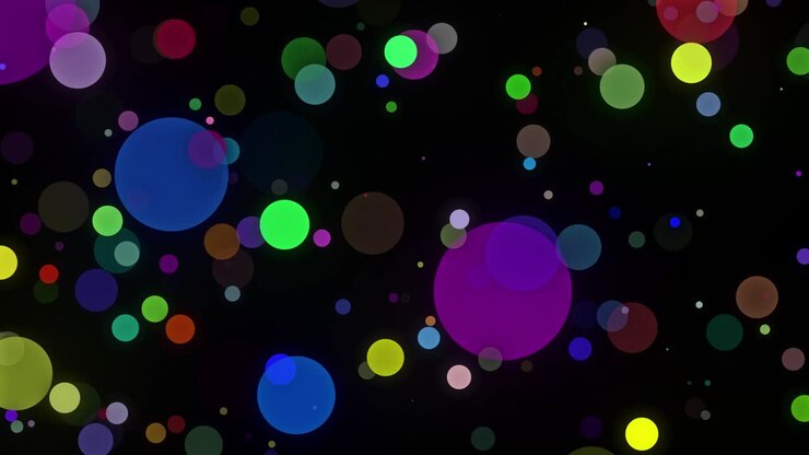 Coriandoli multicolori o particelle di glitter brillano alla luce con profondità di campo. Video 4K. Salvaschermo circolare animato festivo e luminoso