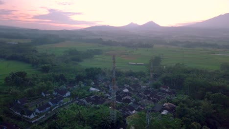 cellular antenna in the middle of the countryside with a view of four mountains