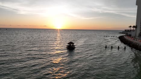 aerial clearwater, florida sunset over little boat