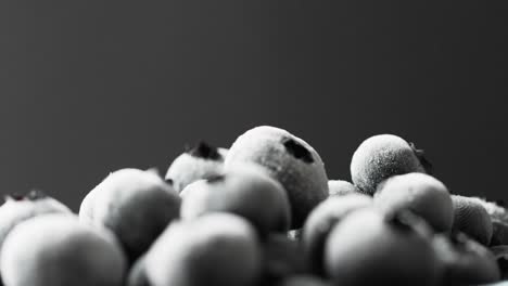 Micro-video-of-blueberries-with-copy-space-on-black-background