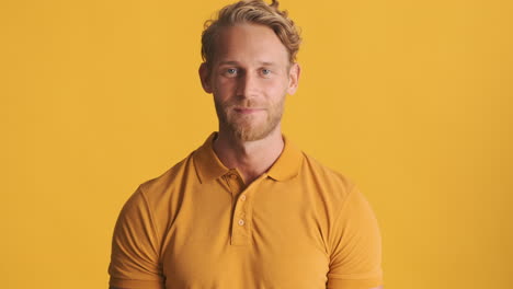 Happy caucasian man smiling in studio