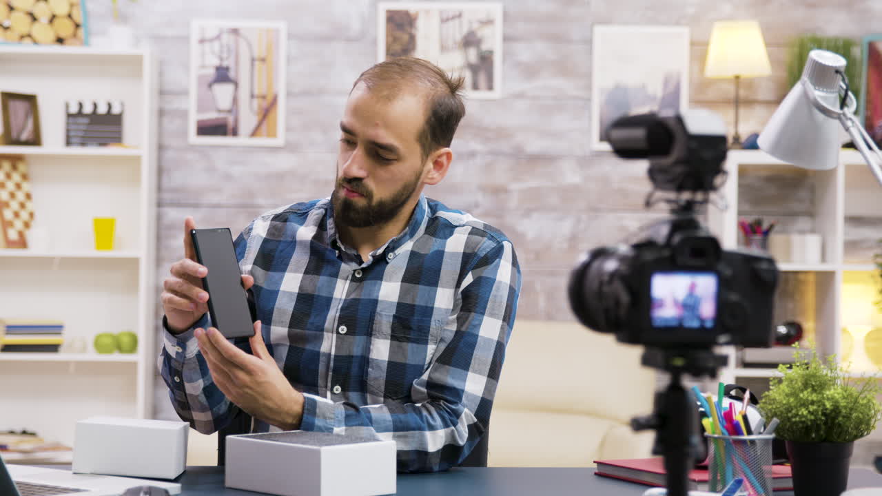 Man Unboxing Phone for Video