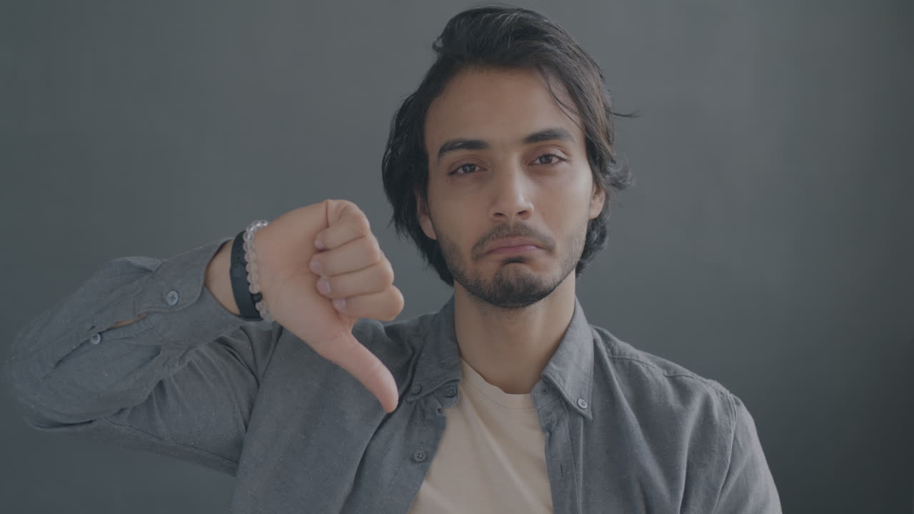 Man giving thumbs down