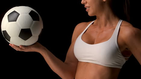 female athlete holding football