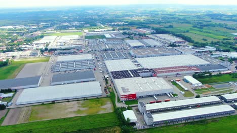 Aerial-footage-of-a-large-shopping-centre-and-car-parks-located-in-the-city